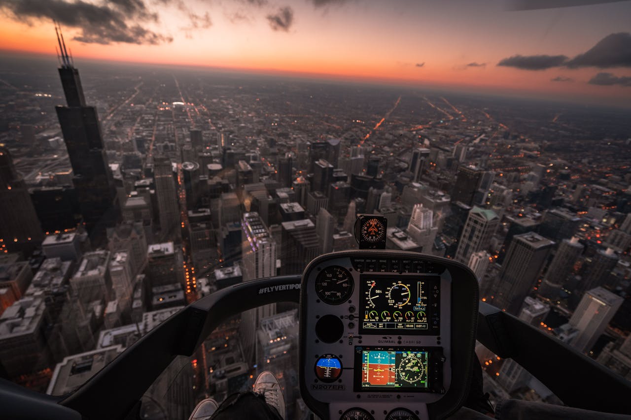 A mesmerizing aerial view of Chicagos skyline at dusk from a helicopter cockpit.